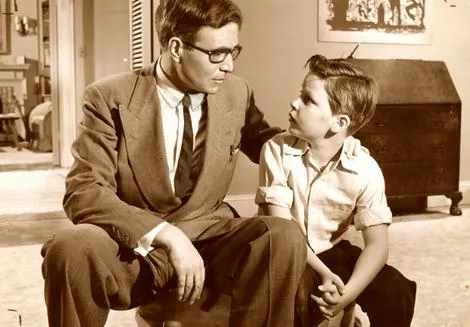A father talking with his son, 1950s photo